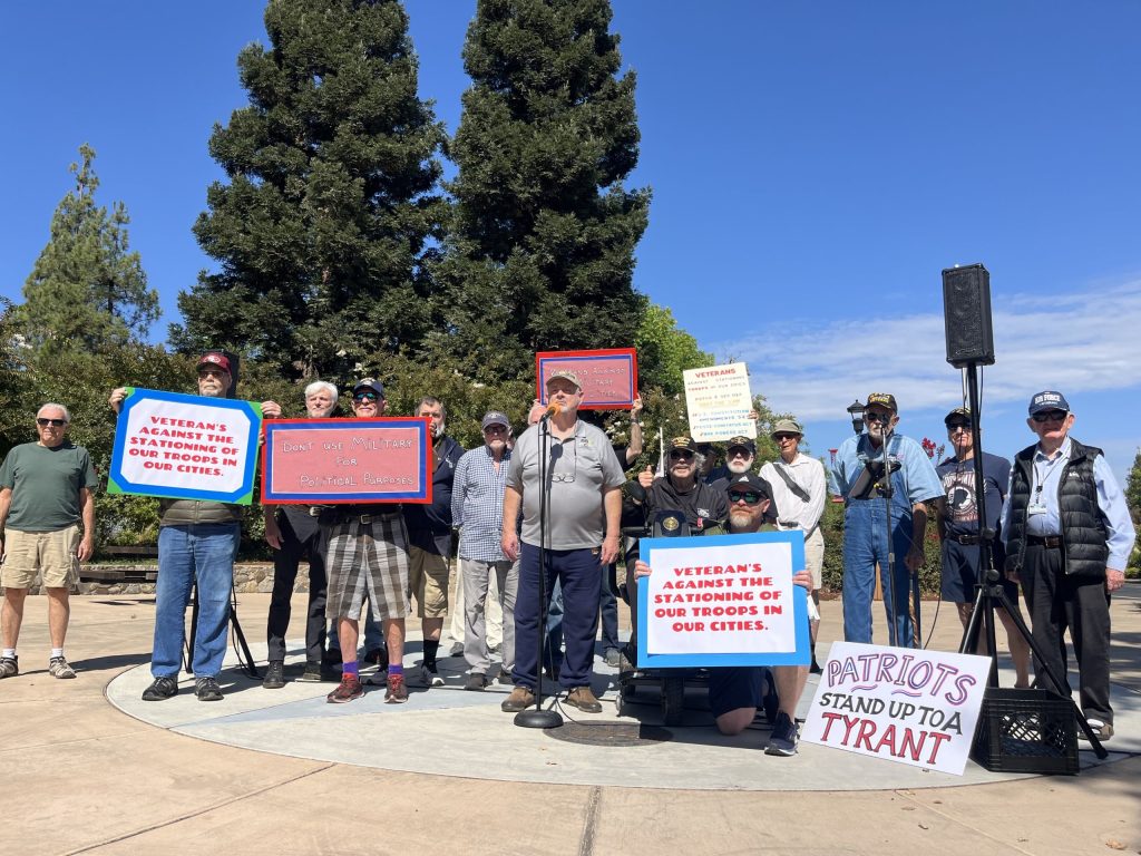 Yountville Veterans rally at Veterans Memorial Park against the deployment of National Guard troops in U.S. cities. David Boone, the event organizer, stands at the microphone. Griffin Jones photo