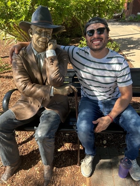 Jonathan with "Sidewalk Judge" statue. Jim McDonald photo