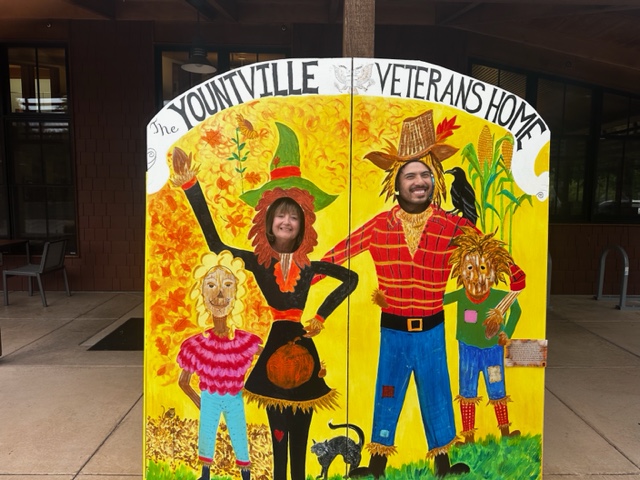 Myrna David and student Jonathan at the Veterans Home Scarecrow display. TJ from the Veterans Home Center for the Arts photo