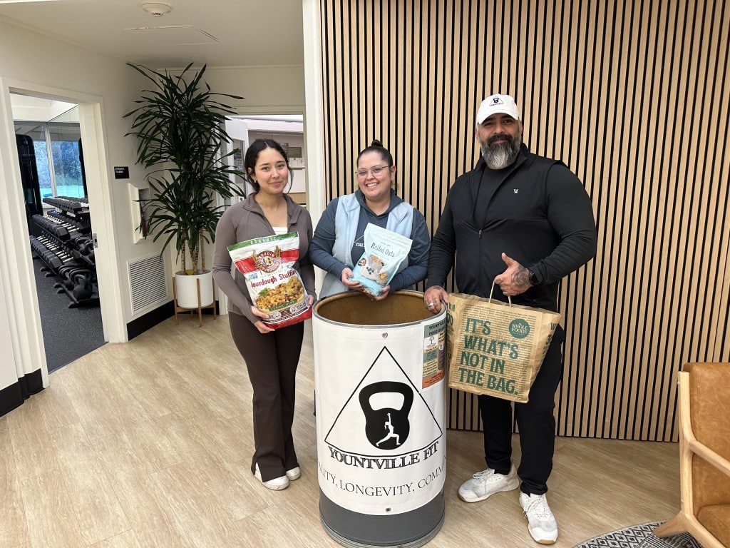 Marian Solis, Arianna Aviña and Fred Espinoza at Yountville Fit are pumped up to collect food. Lisa Adams Walter photo