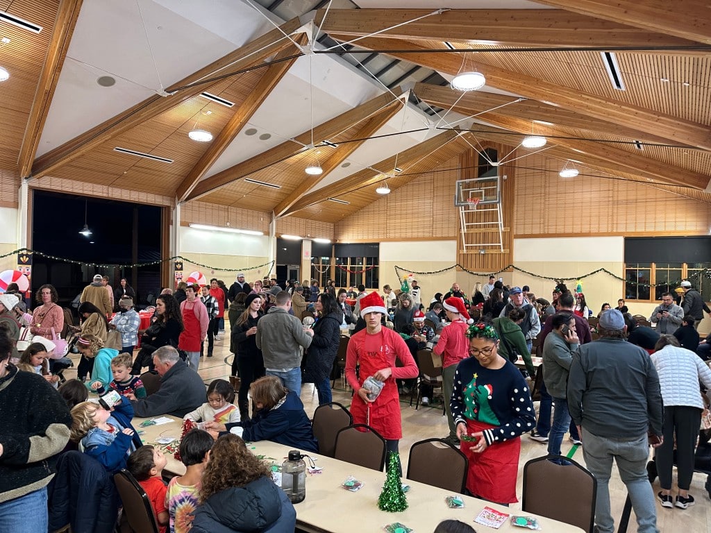 Elves filled the Community Center gym to assist children with crafts and activities. Lisa Adams Walter photo