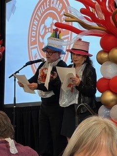 Steven Miller and Iren Jenny promoting the Molly’s Angels Crab Feed dessert auction. Susan Wiechers photo
