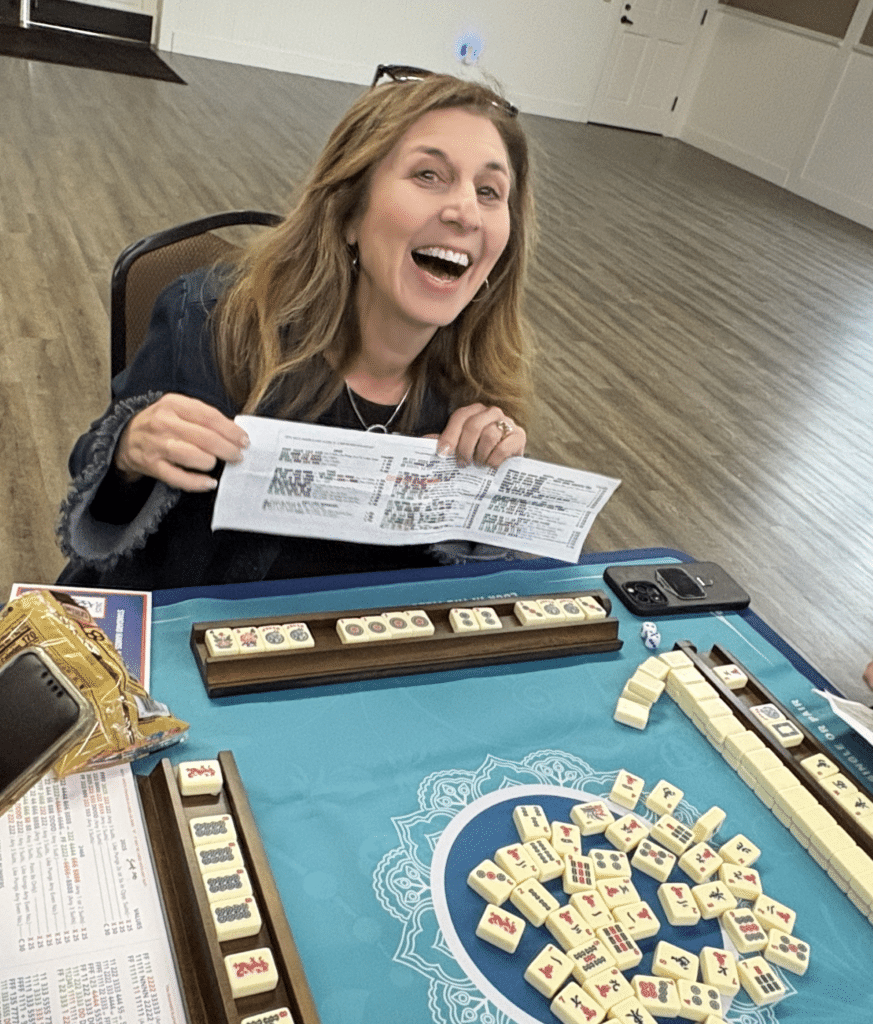 A winner celebrates at Mah-jongg in Yountville. Submitted photo