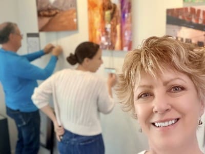 Photographer Katherine Zimmer shoots a selfie at the installation of her art show in Yountville. Submitted photo