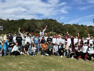 The Mixed Nutts and Bouchon Bistro Baguettes teams celebrate on Borman Field on Oct. 20. Lisa Adams Walter photo